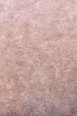 The grunge stucco cement wall background.