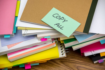 Copy All; The Pile of Business Documents on the Desk