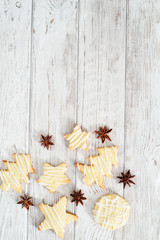 Christmas mood , festive cookies with  cinnamon on a wooden background
