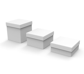 Three different size white boxes, square shape