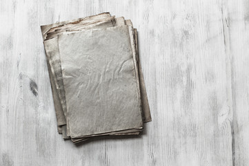 old papers on wooden background