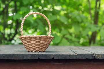 wicker basket on old wooden table