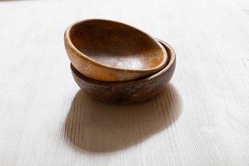 wooden bowls on white table