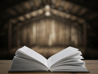 book on table in old wooden interior