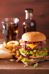 bacon cheese burger with beef patty tomato onion cola