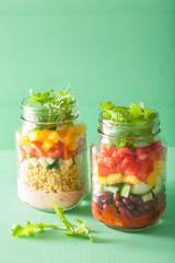 vegan quinoa bean vegetable salad in mason jars