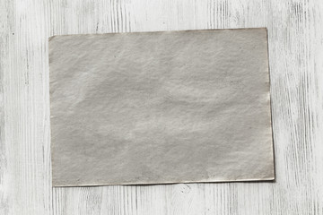 paper on wooden background