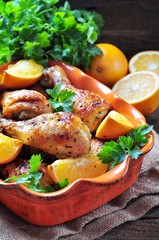 Baked chicken drumstick with orange, smoked paprika, Provencal herbs and olive oil.