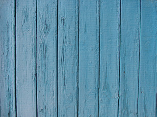 Fototapeta na wymiar Planks of light blue wooden fence