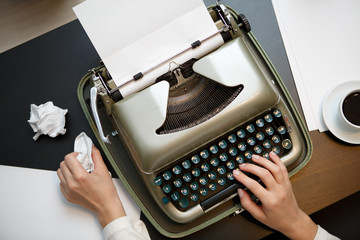 Vintage typewriter and white paper