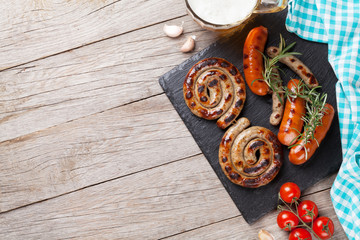 Grilled sausages and beer mug