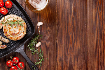 Grilled sausages and beer mug