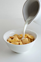 Pouring Milk into Bowl of Corn Flakes
