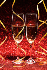 glasses of champagne with yellow holidays ribbons