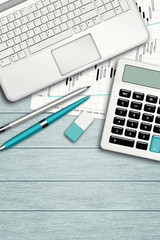 workplace with computer, calculator, stationery and place for te