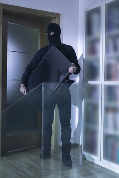 Robber in black mask