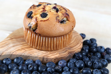 Blueberries muffin on wooden background