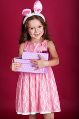 Happy bunny girl is holding gift boxes