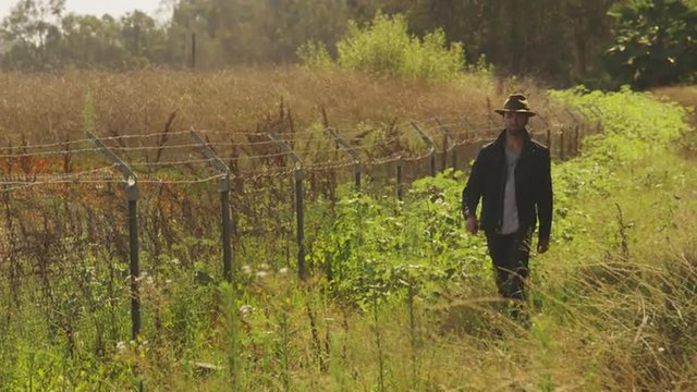 Sexy Hispanic man walking outdoors