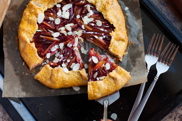 Fresh plum pie with almonds