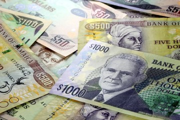 Assorted Jamaican money banknotes - Financial security concept background