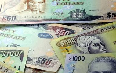 Assorted Jamaican money banknotes - Financial security concept background