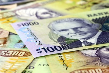 Assorted Jamaican money banknotes - Financial security concept background