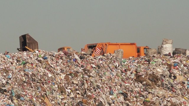 garbage truck on landfill, environment issue and nature pollution concept.