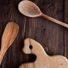 Old wood spoon on table, square