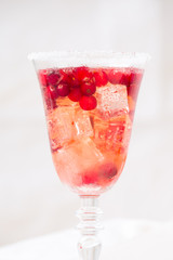 Glass of champagne and cranberry cocktail