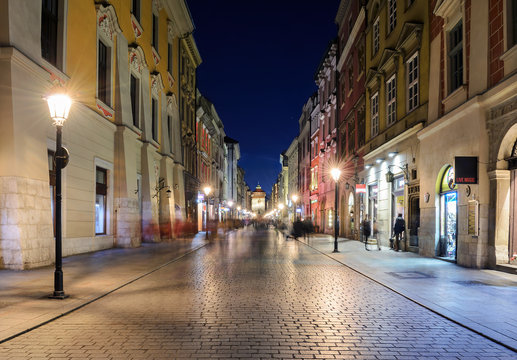 Fototapeta Colorful street in Krakow in the evening.