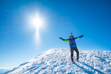 smiling woman on a snowy mountain