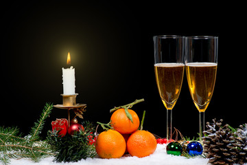 Fototapeta na wymiar Two glasses of champagne with christmas decor