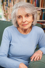 Portrait Of Senior Female Sitting In Armchair