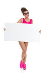 Woman In Pink Holding Banner