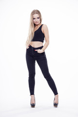 Young slim sexy woman in black dress isolated on white backgroun