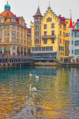Buildings on the embankment of Reuss river
