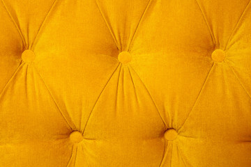 Background of velvet (fabric) modern yellow sofa