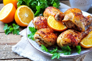 Baked chicken drumstick with orange, smoked paprika, Provencal herbs and olive oil.