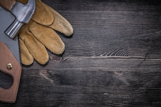 Composition of hack-saw claw hammer protective leather gloves