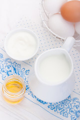 Fototapeta na wymiar Composition with milk, yoghurt, honey and eggs