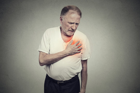 senior man suffering from bad pain in his chest heart attack