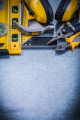 Try square construction level claw hammer pliers tin snips earmu