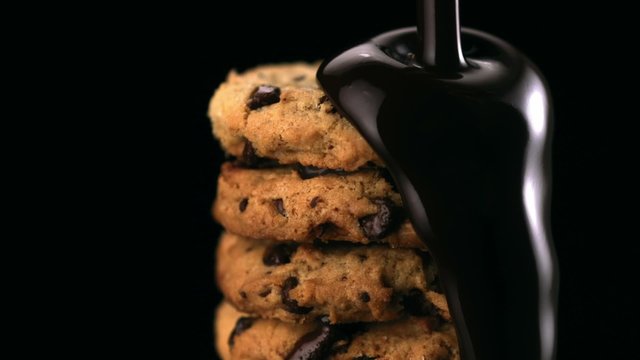 Chocolate sauce on cookie shooting with high speed camera.