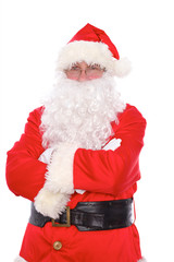 Kind Santa Claus standing with crossed arms, isolated on white background