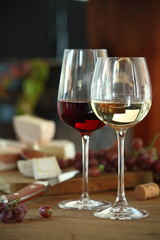 Red and white wine served with cheese