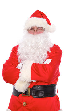 Kind Santa Claus standing with crossed arms, isolated on white background
