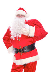 Kind Santa Claus carrying big bag, isolated on white background