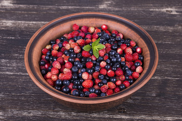 Fresh fruit salad with strawberries and blueberries , wild berry