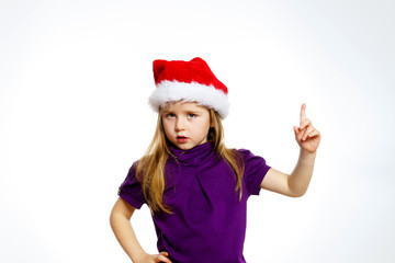 Cute little girl in santa hat touching transparent screen, isolated on white